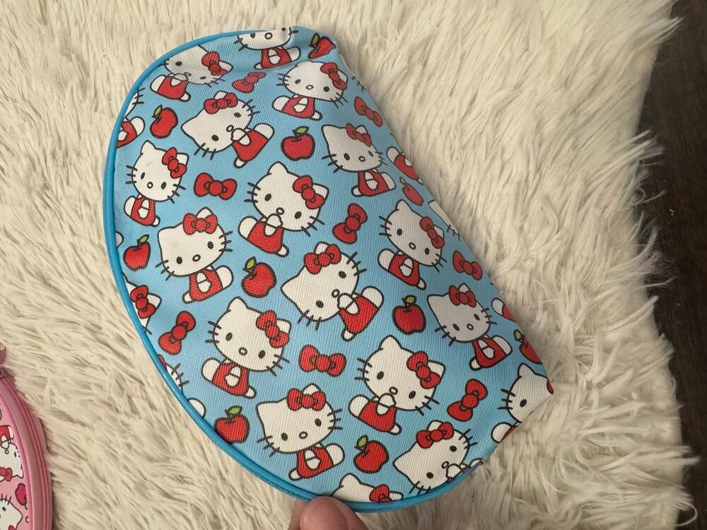 Sanrio Hello Kitty blue pencil case makeup pouch with red bows and apples